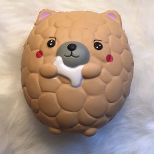 Cute, dog holding a bone squishy